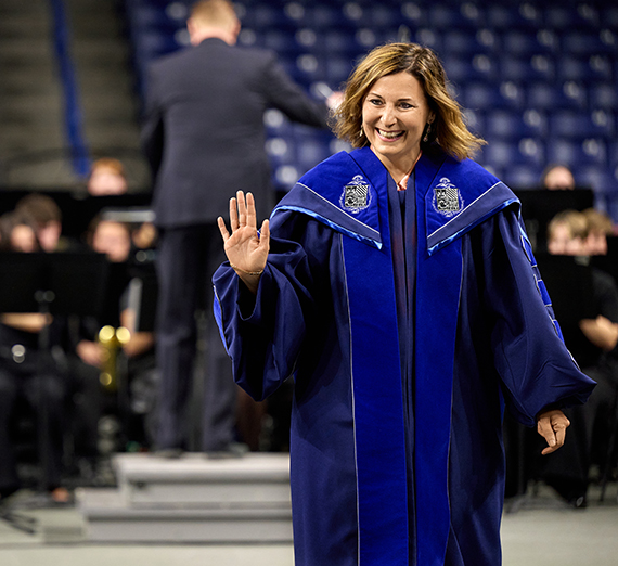 President Katia Passerini stands in front of windows in Hemmingson Center